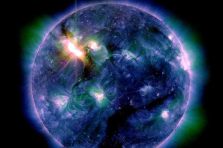 Solar flares hurl charged particles at Earth