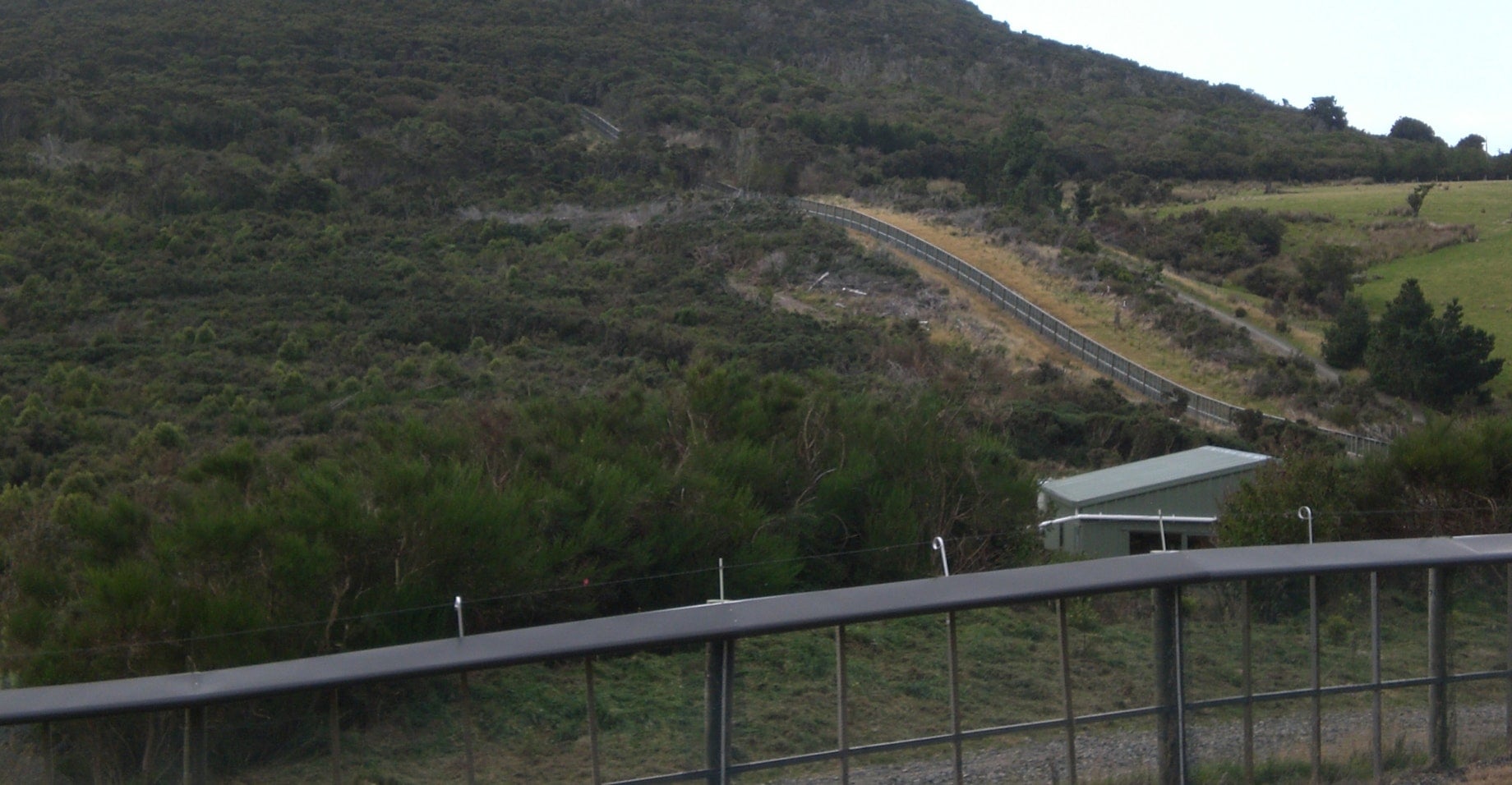 Predator-proof fence surrounding Ōrokonui Ecosanctuary, NZ